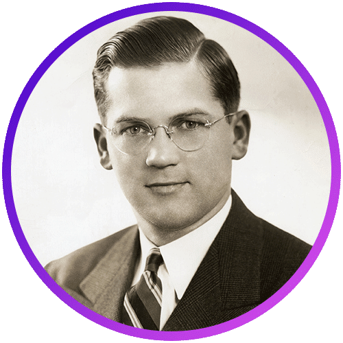 A black-and-white portrait of a man wearing glasses, a suit, and a striped tie. His hair is neatly combed to the side. The image is framed with a purple circle.