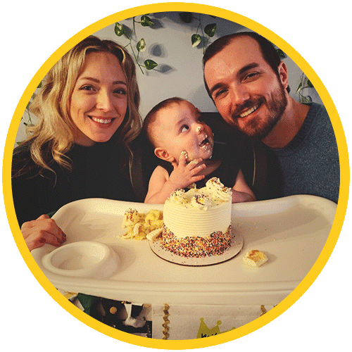 Black and white portrait of a person with long, light hair smiling softly. They are wearing a collared shirt and drop earrings, exuding the poised confidence often seen in sales assessments. The photo is enclosed in a circular, blue border.