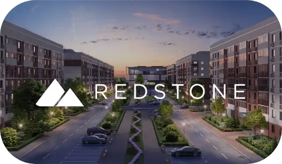A dusk view of a modern apartment complex with multiple buildings, well-maintained landscaping, and parked cars along the road. The foreground features a logo with two white triangle shapes and the text "REDSTONE" in capital letters—ideal for your hiring assessment backdrop.