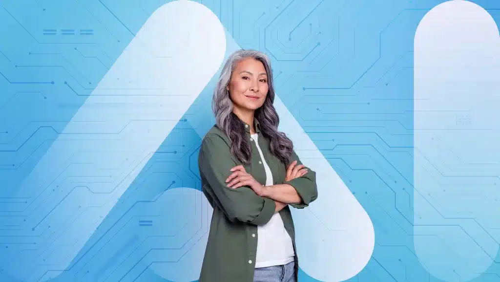 A confident woman with long gray hair stands with arms crossed in front of a blue background featuring circuit-like patterns and a large stylized letter "A". She embodies AI and the Future of Hiring, wearing a green jacket over a white shirt and smiling at the camera.